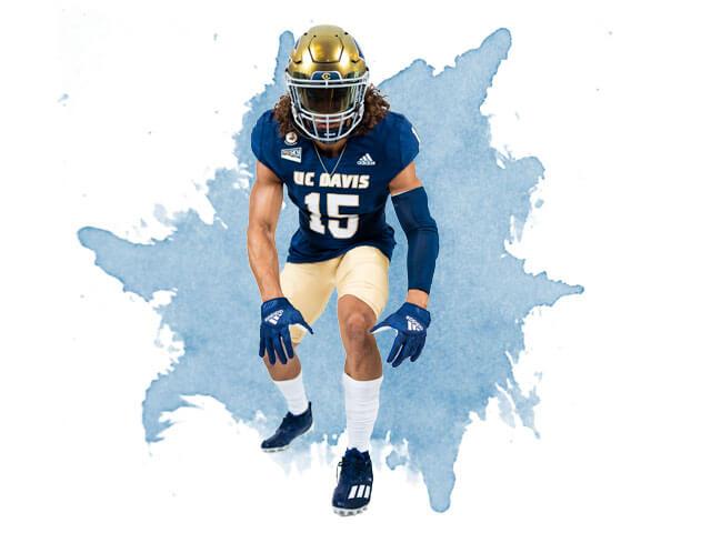 A football player posing in his uniform